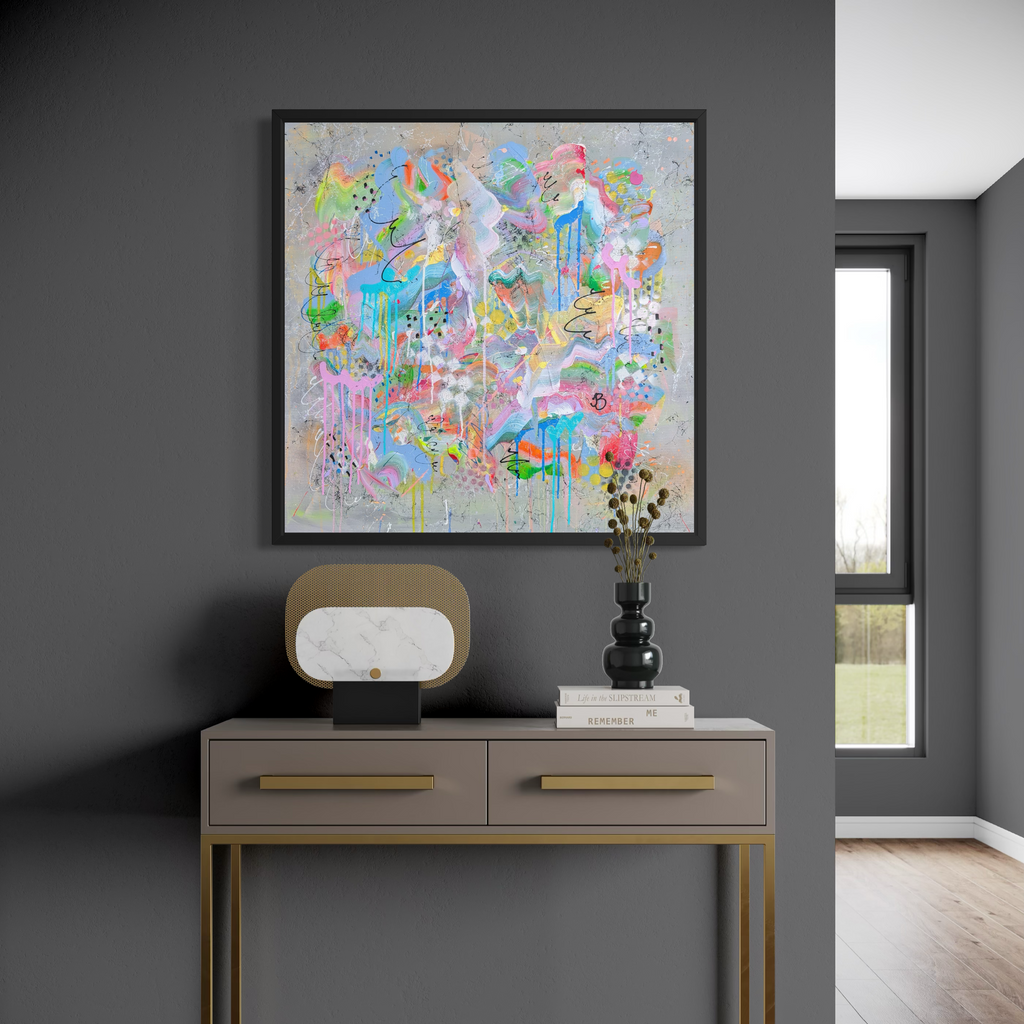 Colourful abstract painting on a gray wall above a console table with decorative items.