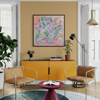 Modern living room with yellow cabinet, brown chairs, and colourful abstract art on a beige wall.