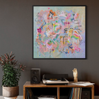 Abstract artwork on a wall above a wooden console table with a plant and record player.