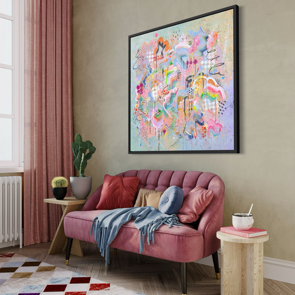 Beautiful colourful abstract painting in stylish interiors with blush pink couch.