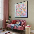 Beautiful colourful abstract painting in stylish interiors with blush pink couch.