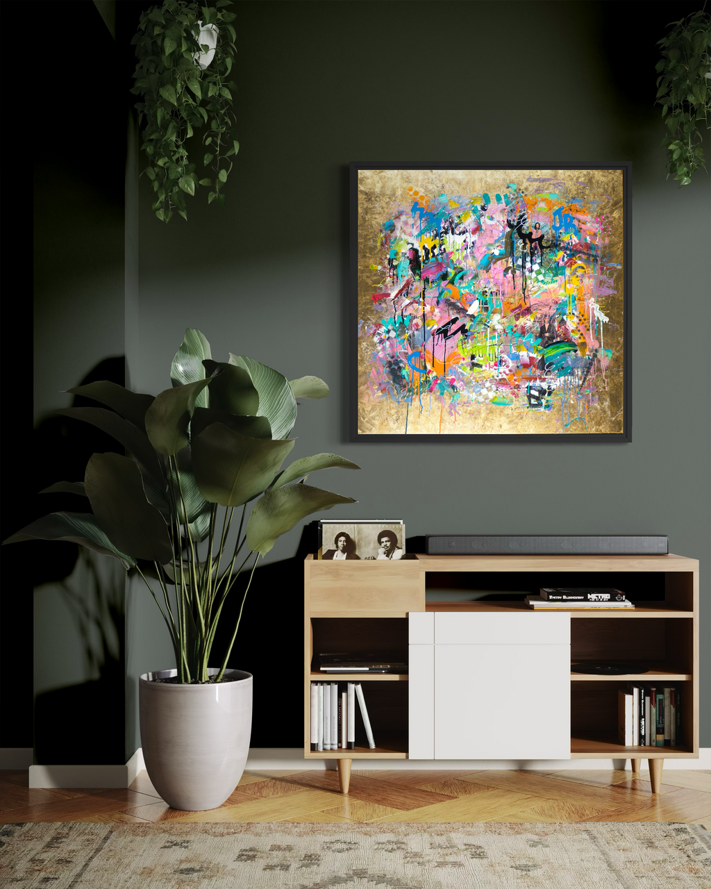 Modern living room with a colorful abstract painting on the wall, a wooden cabinet, and a plant.