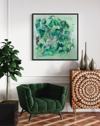 Modern living room with a green armchair, decorative cabinet, and abstract artwork on the wall.