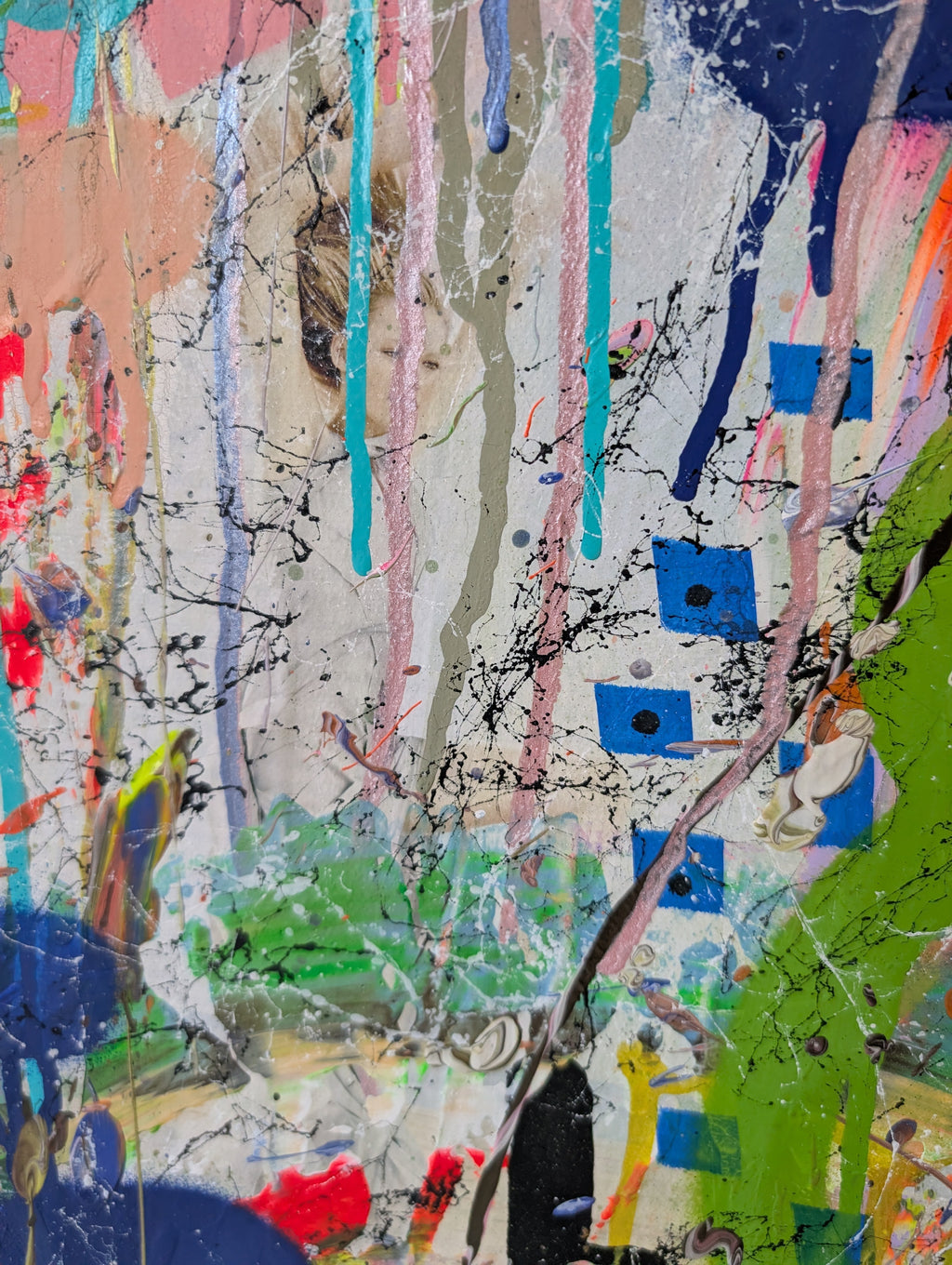 Abstract artwork with collage and colourful splashes and drips on a textured surface