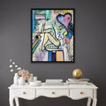 Abstract painting on a gray wall above a white console table with decorative items.