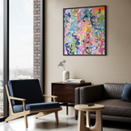 Modern living room with a coloruful abstract painting on the wall.