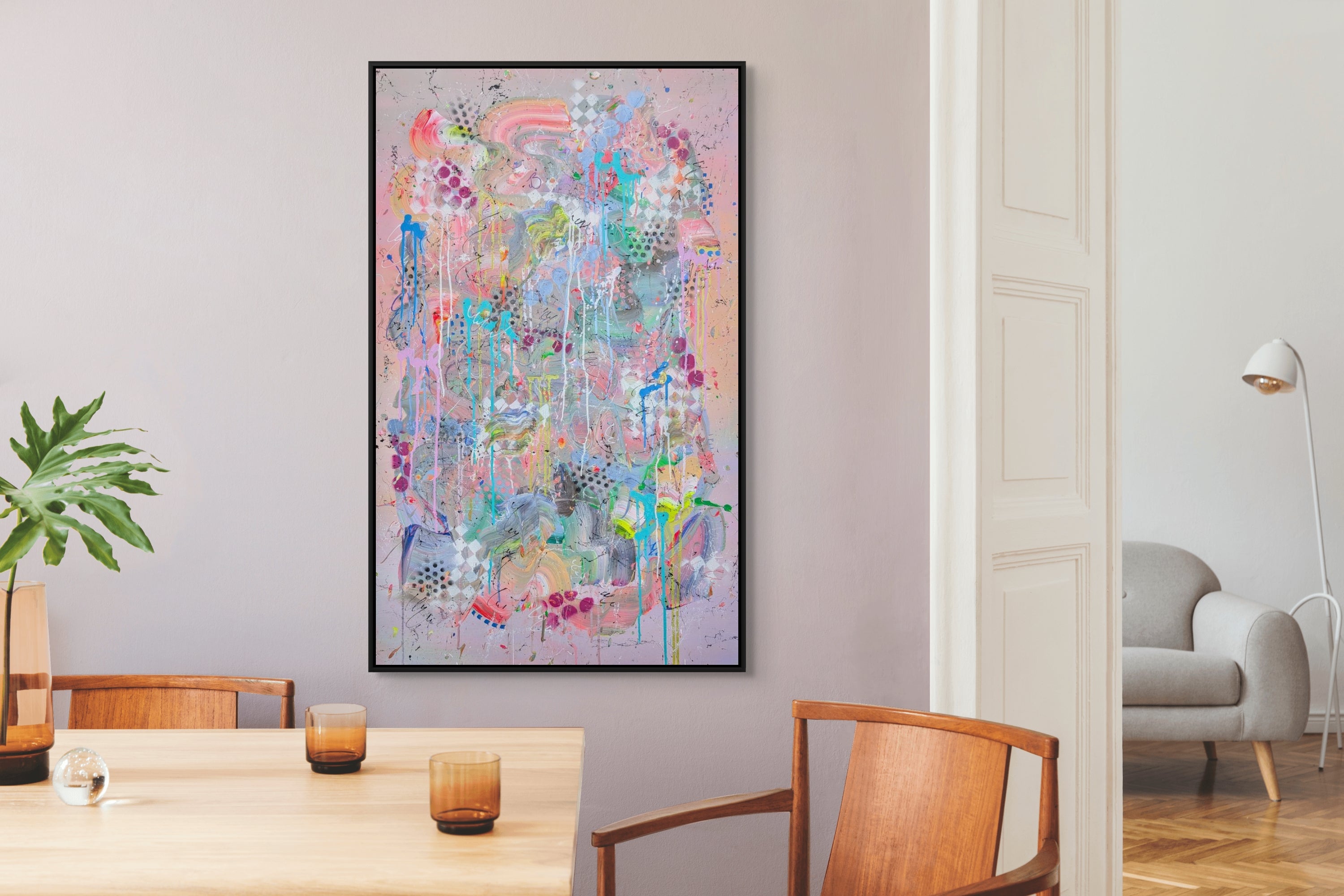 Colorful abstract painting on a wall in a modern living room.