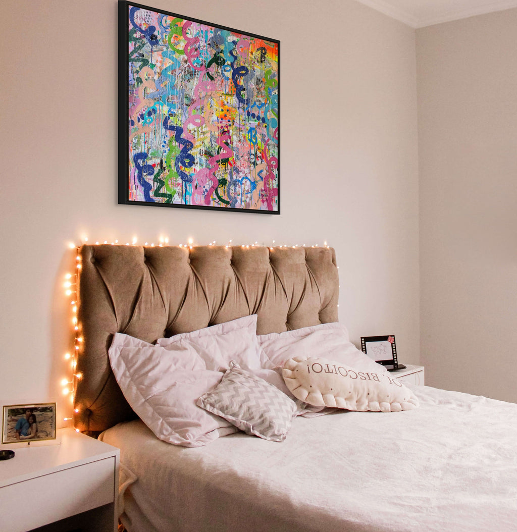 Bedroom with a bed, headboard, and colourful abstract painting on the wall.